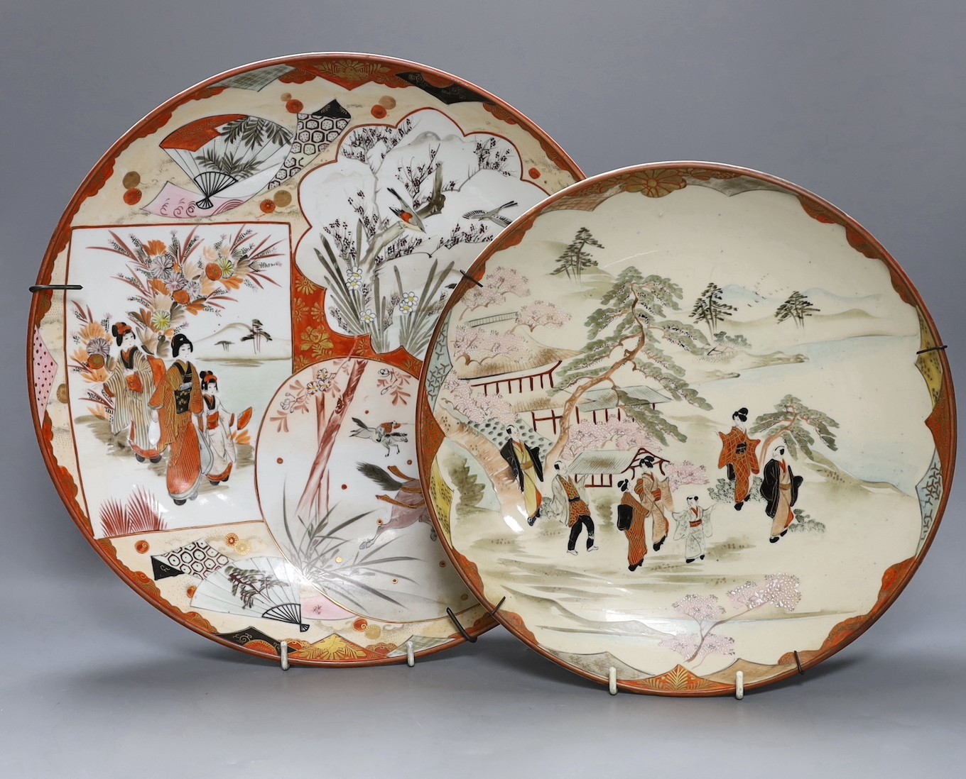 Two Japanese kutani chargers, signed, largest 36 cms diameter